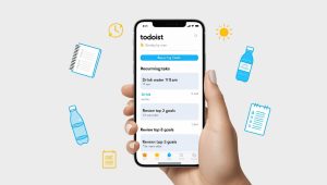 Todoist app on a smartphone showing recurring tasks like “Drink water” and “Review top 3 goals.”